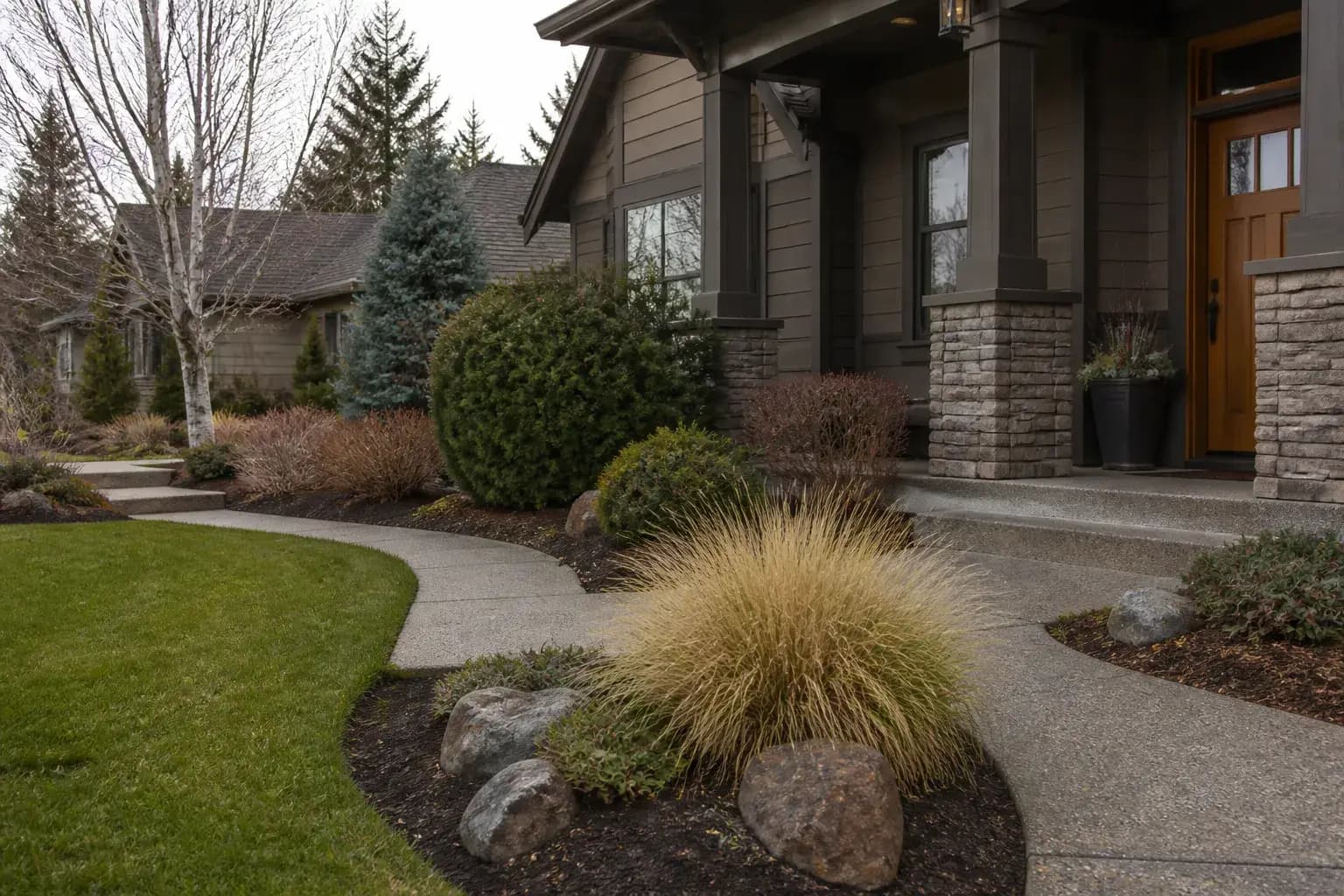 Cleaned-up yard with refreshed beds and hardscape